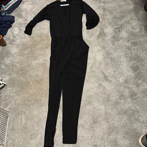 Michael Kors jumpsuit in Black. Nice detailing on shoulders.